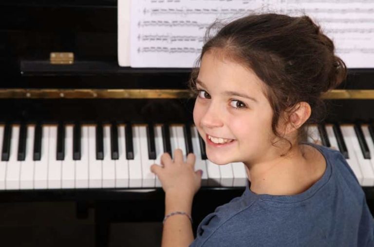 Young girl playing the piano