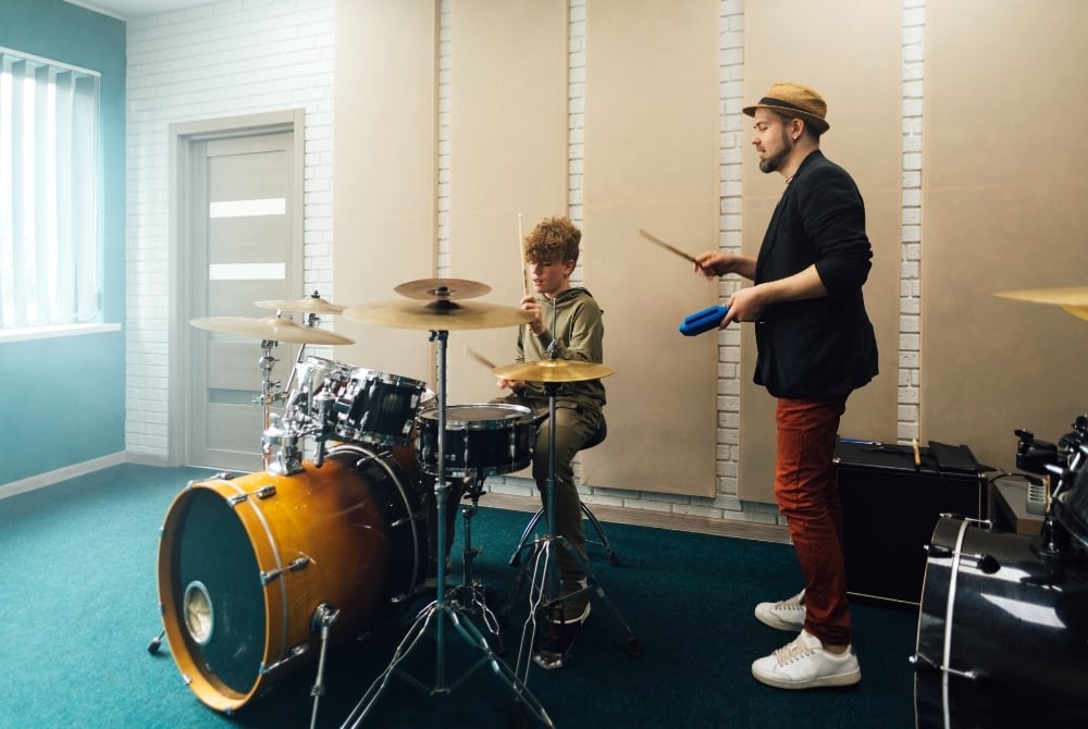 drum teacher teaching student